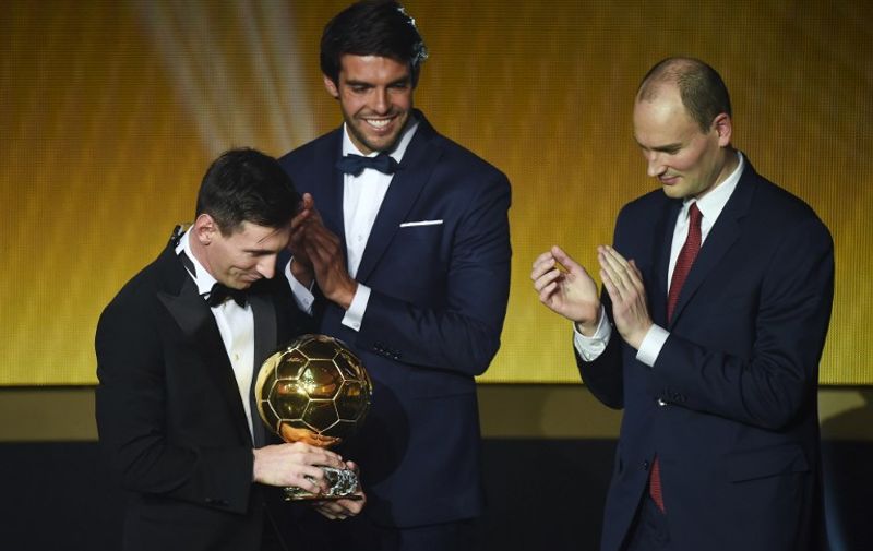 FC Barcelona and Argentina's forward Lionel Messi (L) holds his trophy as Brazil and Orlando City midfielder Kaka (C) and Amaury Sport Organisation (ASO) president Jean-Etienne Amaury  applaud after receiving the 2015 FIFA Ballon dOr award for player of the year during the 2015 FIFA Ballon d'Or award ceremony at the Kongresshaus in Zurich on January 11, 2016. AFP PHOTO / OLIVIER MORIN / AFP / OLIVIER MORIN