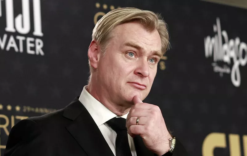 British director Christopher Nolan, winner of the Best Picture award for Oppenheimer, speaks to journalists in the press room during the 29th Annual Critics Choice Awards at the Barker Hangar in Santa Monica, California on January 14, 2024. (Photo by Michael TRAN / AFP)
