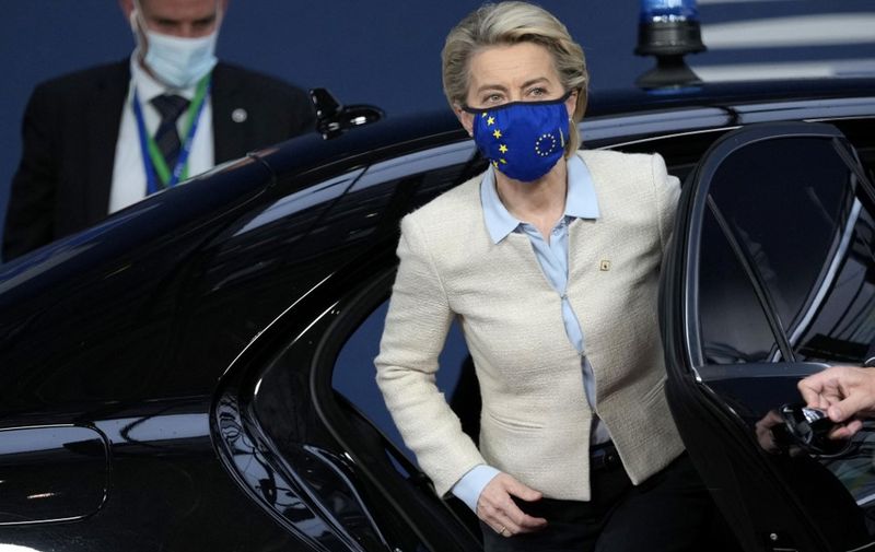 European Commission President Ursula von der Leyen steps out of a car as she arrives for an EU summit at the European Council building in Brussels, on May 24, 2021. - European Union leaders take part in a two day in-person meeting to discuss the coronavirus pandemic, climate and Russia. (Photo by Francisco SECO / POOL / AFP)