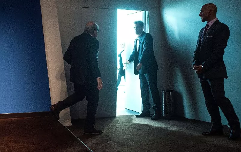 FIFA President Sepp Blatter (L) leaves after a press conference at the headquarters of the world's football governing body in Zurich on June 2, 2015. Blatter resigned as president of FIFA as a mounting corruption scandal engulfed world football's governing body. The 79-year-old Swiss official, FIFA president for 17 years and only reelected days ago, said a special congress would be called to elect a successor. AFP PHOTO / 