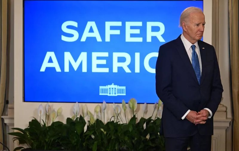 US President Joe Biden looks on before he speaks about his administration's efforts to fight crime and make our communities safer, in the State Dining Room of the White House in Washington, DC, on February 28, 2024. (Photo by Jim WATSON / AFP)