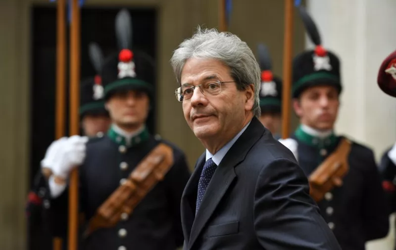 Italy's Prime Minister Paolo Gentiloni looks on before a meeting with Cameroon's President Paul Biya (not pictured) on March 20, 2017 at the Palazzo Chigi in Rome.  / AFP PHOTO / ANDREAS SOLARO