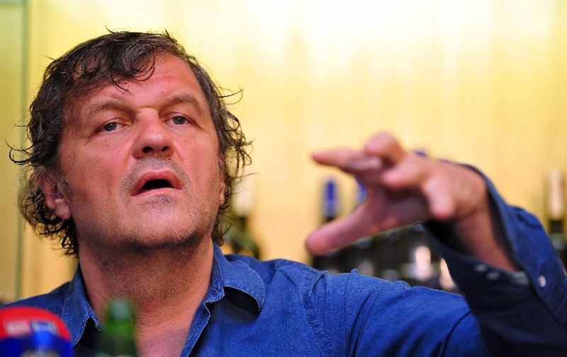 Bosnian-born film director Emir Kusturica answers journalists' questions during a press conference in the southern Bosnian town of Trebinje, on August 13, 2013. Kusturica is currently shooting his newest film, "On the Milky Road", in southern Bosnia, starring Italian actress Monica Bellucci as a title female role. AFP PHOTO ELVIS BARUKCIC / AFP PHOTO / ELVIS BARUKCIC