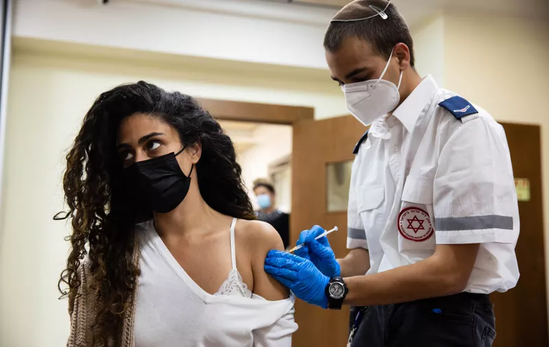 January 21st, 2021 - Petah Tikvah, Israel. EXCLUSIVE. Paramedics of MDA (Magen David Adom) are vaccinating the staff and residents of the nursing home Nof Hamoshava with the Pfizer vaccine. In the picture paramedic Asaf Duman,Image: 585719609, License: Rights-managed, Restrictions: No publication in Israel, Model Release: no