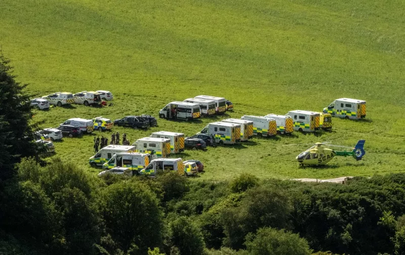 Emergency response vehicles are parked near the scene of a train crash by Stonehaven in northeast Scotland on August 12, 2020. - A passenger train derailed in northeast Scotland on Wednesday, with reports of "serious injuries" in what First Minister Nicola Sturgeon described as "an extremely serious incident". (Photo by Michal Wachucik / AFP)