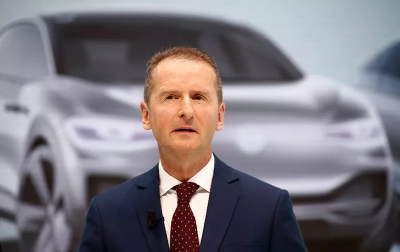 Newly appointed CEO of German car maker Volkswagen (VW) Herbert Diess arrives for a press conference at the company's headquarters in Wolfsburg, central Germany, on April 13, 2018, one day after the company announced a wider management shake-up. - German auto giant Volkswagen on Thursday (April 12, 2018) had named Herbert Diess as its new chief executive, replacing Matthias Mueller, as the one-time paragon of German industry seeks to turn the page on the "dieselgate" emissions scandal that has dogged it since 2015. (Photo by Odd ANDERSEN / AFP)
