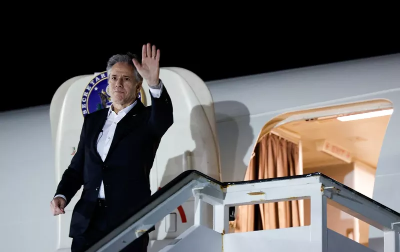 US Secretary of State Antony Blinken waves as he boards a plane leaving Crete for Amman, on January 6, 2024, as part of the first leg of a trip that includes visits to both Israel and West Bank. (Photo by EVELYN HOCKSTEIN / POOL / AFP)