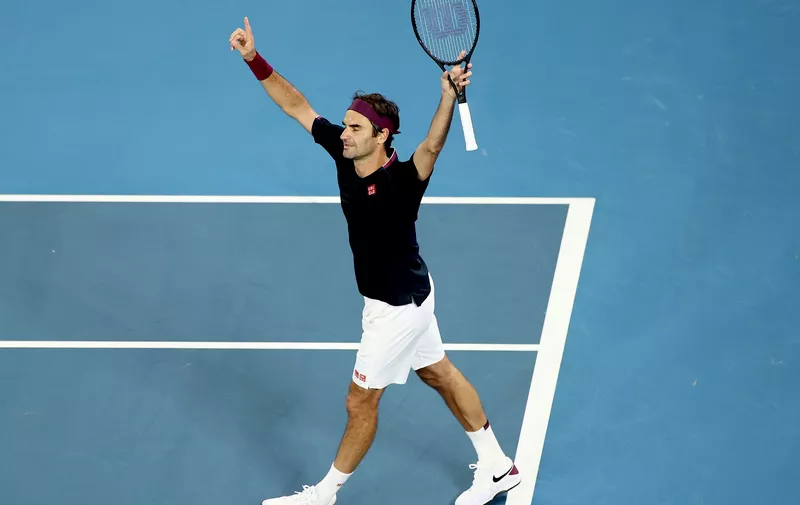 MELBOURNE, AUSTRALIA - JANUARY 24: Roger Federer of Switzerland celebrates after winning his Men's Singles third round match against John Millman of Australia on day five of the 2020 Australian Open at Melbourne Park on January 24, 2020 in Melbourne, Australia. (Photo by Hannah Peters/Getty Images)