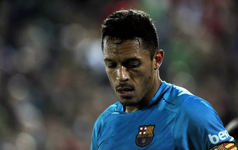 Barcelona's Brazilian defender Adriano looks on during the Spanish Copa del Rey (King's Cup) Round of 32 first leg football match CF Villanovense vs FC Barcelona at the Romero Cuerda stadium in Villanueva de la Serena on October 28, 2015. The match ended in a draw 0-0.AFP PHOTO / CRISTINA QUICLER