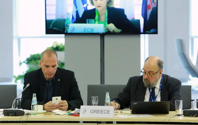 Greek Finance Minister Yanis Varoufakis (L) attends the Informal Meeting of Ministers for Economic and Financial Affairs (ECOFIN)  in Riga, Latvia on April 24, 2015.   AFP PHOTO / HO / LATVIAN GOVERNMENT / DMITRIJS SULZICS