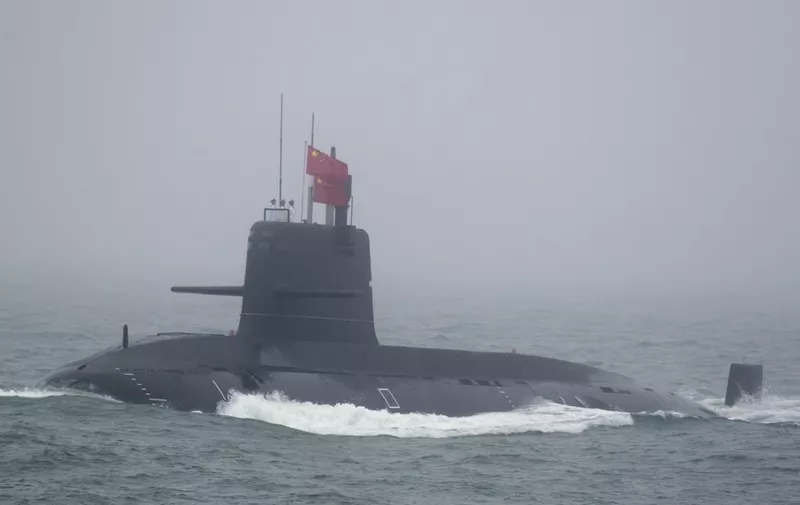 A Great Wall 236 submarine of the Chinese People's Liberation Army (PLA) Navy, billed by Chinese state media as a new type of conventional submarine, participates in a naval parade to commemorate the 70th anniversary of the founding of China's PLA Navy in the sea near Qingdao, in eastern China's Shandong province on April 23, 2019. China celebrated the 70th anniversary of its navy by showing off its growing fleet in a sea parade featuring a brand new guided-missile destroyer. (Photo by Mark Schiefelbein / POOL / AFP)