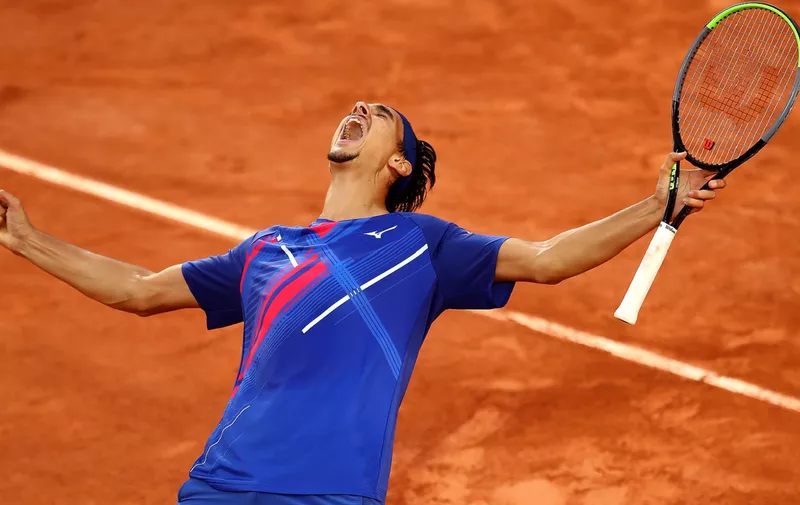 PARIS, FRANCE - OCTOBER 02: Lorenzo Sonego of Italy celebrates after winning match point during his Men's Singles third round match against Taylor Fritz of the United States on day six of the 2020 French Open at Roland Garros on October 02, 2020 in Paris, France. (Photo by Julian Finney/Getty Images)