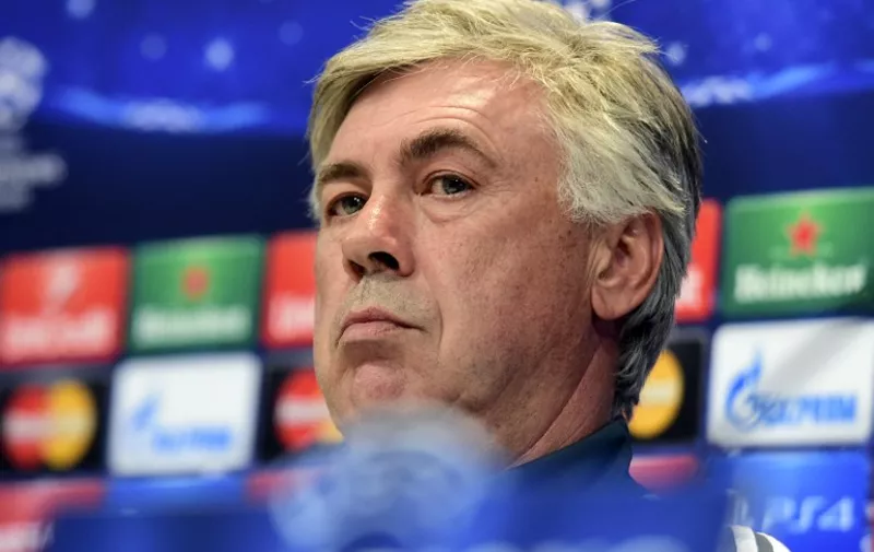Real Madrid's Italian coach Carlo Ancelotti looks on during a press conference at Valdebebas training ground in Madrid on May 12, 2015, on the eve of the UEFA Champions League semi-final second leg football match Real Madrid CF vs Juventus.  AFP PHOTO/ GERARD JULIEN