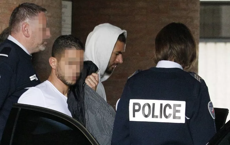 ALTERNATIVE CROP
Real Madrid's French striker Karim Benzema leaves the court house in Versailles, near Paris, on November 5, 2015. Real Madrid striker Karim Benzema has admitted involvement in an alleged extortion case over a sex tape featuring fellow French international Mathieu Valbuena and appeared before judge today, legal sources said. The 27-year-old star told investigators he approached Valbuena about the tape on behalf of "a childhood friend."  AFP PHOTO / MATTHIEU ALEXANDRE