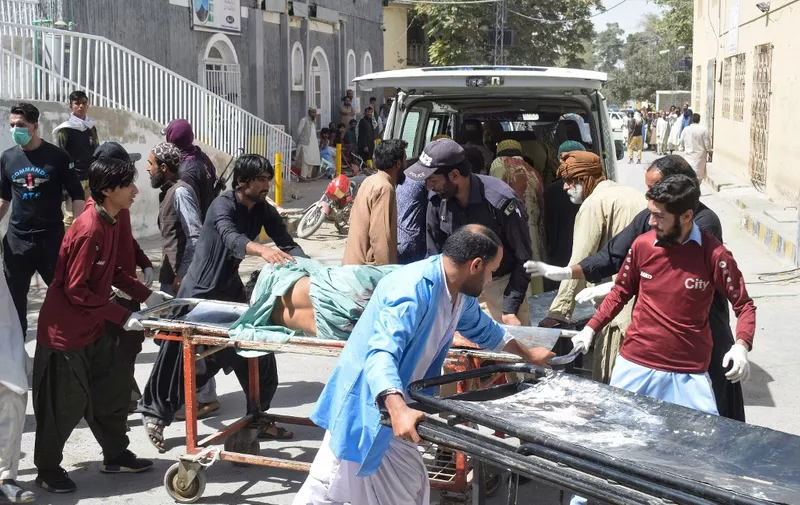 Volunteers carry a blast victim on a stretcher at a hospital in Quetta on September 29, 2023, after a suicide bombing in Mastung district. At least 25 people were killed and dozens more wounded on September 29 by a suicide bomber targeting a procession marking the birthday of Islam's Prophet Mohammed in Pakistan's southwestern Balochistan province. (Photo by AFP)