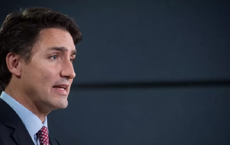 Canadian Liberal Party leader Justin Trudeau speaks at a press conference in Ottawa on October 20, 2015 after winning the general elections.  Liberal leader Justin Trudeau reached out to Canada's traditional allies after winning a landslide election mandate to change tack on global warming and return to the multilateralism sometimes shunned by his predecessor.   AFP PHOTO/NICHOLAS KAMM