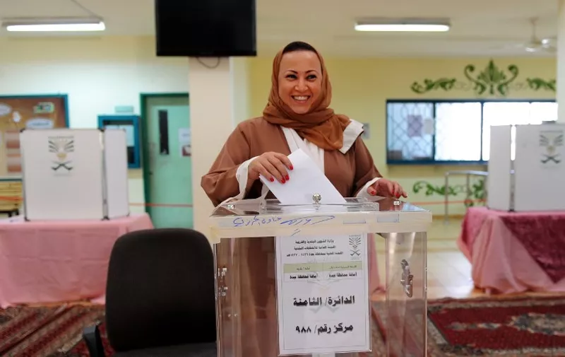 A Saudi woman casts her ballot in a polling station in the coastal city of Jeddah, on December 12, 2015. Saudi women were allowed to vote in elections for the first time ever, in a tentative step towards easing widespread sex discrimination in the ultra-conservative Islamic kingdom. AFP PHOTO / STR / AFP / -