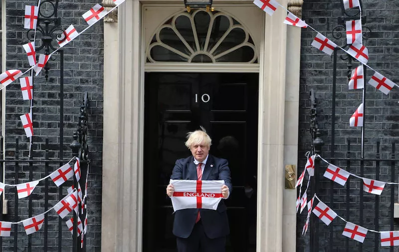 July 9, 2021, London, England, United Kingdom: UK Prime Minister BORIS JOHNSON holds England flag outside 10 Downing Street ahead of Euro 2020 final match against Italy on Sunday. London United Kingdom - ZUMAs262 20210709_zip_s262_083 Copyright: xTayfunxSalcix