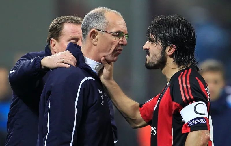 AC Milan's Gennaro Gattuso (R) argues with Tottenham Hotspur's first team coach Joe Jordan (C) next to manager Harry Redknapp during the Champions League soccer match at the San Siro stadium in Milan February 15, 2011. REUTERS/Stefano Rellandini  (ITALY - Tags: SPORT SOCCER IMAGES OF THE DAY)
