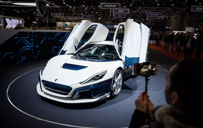 A Rimac C-Two model car is seen at the booth of Croatian carmaker on March 5, 2019 during a press day ahead of the Geneva International Motor Show in Geneva. - The 2019 edition of the Geneva International Motor Show will be held from March 7 to March 17, 2019. (Photo by Fabrice COFFRINI / AFP)