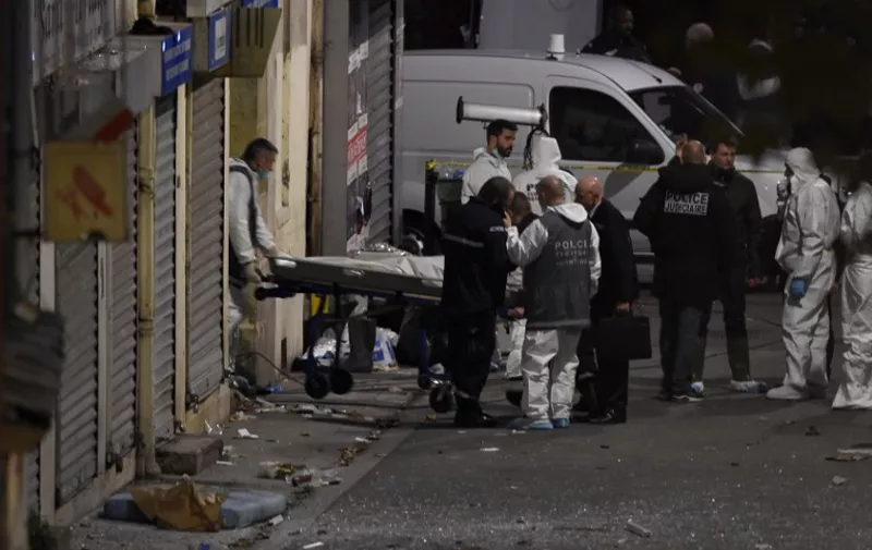 A second body is removed from the apartment raided by French Police special forces earlier in the northern Paris suburb of Saint-Denis, on November 18, 2015, hunting those behind the attacks that claimed 129 lives in the French capital five days ago. French police said the assault had concluded on an apartment in northern Paris in which at least two jihadists were killed and seven arrested. AFP PHOTO / ERIC FEFERBERG