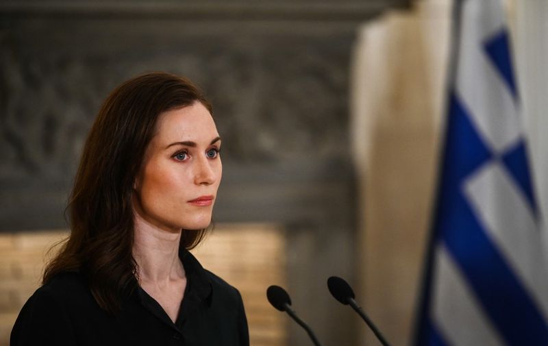 Finnish Prime Minister Sanna Marin attends at a press conference with the Greek prime minister after their meeting at the Maximos Mansion, in Athens, on April 28, 2022. (Photo by Angelos Tzortzinis / AFP)