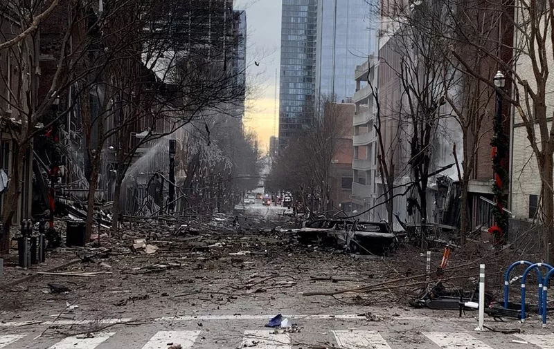 In this photo from the Twitter page of the Nashville Fire Department, damage is seen on a street after an explosion in Nashville, Tennessee on December 25, 2020. - An explosion that rocked downtown Nashville causing extensive damage on Christmas morning was linked to a vehicle and appeared to be an "intentional act," police said. (Photo by Handout / Nashville Fire Department / AFP) / RESTRICTED TO EDITORIAL USE - MANDATORY CREDIT "AFP PHOTO / HO/ Twitter/ Nashville Fire Department" - NO MARKETING - NO ADVERTISING CAMPAIGNS - DISTRIBUTED AS A SERVICE TO CLIENTS