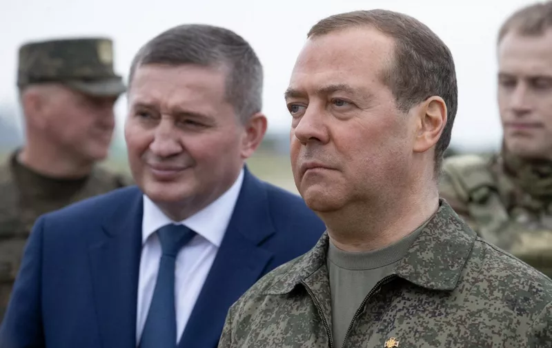 Russia's former leader Dmitry Medvedev, a President Putin ally who is now deputy chairman of the country's security council, visits the Prudboy range in the Volgograd region, southern Russia, on June 1, 2023. (Photo by Yekaterina SHTUKINA / SPUTNIK / AFP)