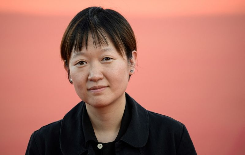South Korean film director Celine Song arrives to attend the 49th edition of the American film festival in Deauville, western France on September 2, 2023. (Photo by LOIC VENANCE / AFP)