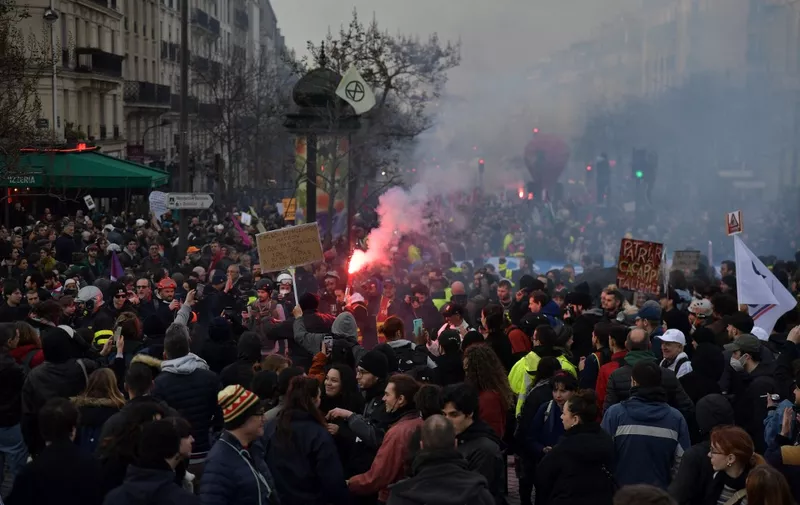 PARIS, FRANCE - March 15: Demonstrators march during a rally against French President's plan to raise the legal retirement age from 62 to 64 in Paris, on March 15, 2023. Firas Abdullah / Anadolu Agency (Photo by Firas Abdullah / ANADOLU AGENCY / Anadolu Agency via AFP)