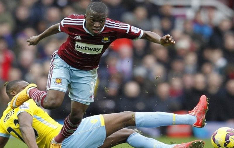 West Ham United's Ecuadorian striker Enner Valencia (front) avoids the tackle from Crystal Palace's Nigerian striker Shola Ameobi during the English Premier League football match between West Ham United and Crystal Palace at Boleyn Ground in Upton Park, East London on February 28, 2015. Crystal Palace won the match 1-3. AFP PHOTO / IAN KINGTON

RESTRICTED TO EDITORIAL USE. NO USE WITH UNAUTHORIZED AUDIO, VIDEO, DATA, FIXTURE LISTS, CLUB/LEAGUE LOGOS OR "LIVE" SERVICES. ONLINE IN-MATCH USE LIMITED TO 45 IMAGES, NO VIDEO EMULATION. NO USE IN BETTING, GAMES OR SINGLE CLUB/LEAGUE/PLAYER PUBLICATIONS.