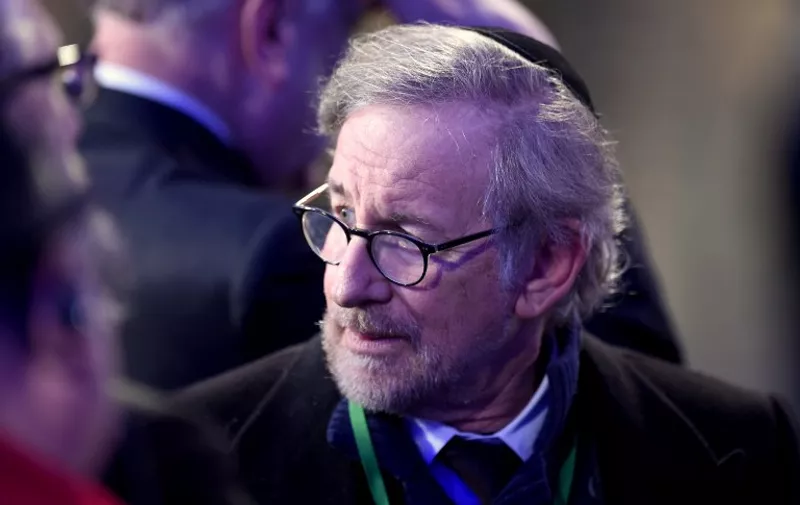 US director Steven Spielberg, a donor for the "18 Pillars of Remembrance project, wears a kippa inside a tent erected in front of the entrance of the former Nazi concentration camp Auschwitz-Birkenau during the main ceremony to mark the 70th anniversary of the liberation of the death camp on January 27, 2015 in Oswiecim, Poland. Seventy years after the liberation of Auschwitz, ageing survivors and dignitaries gather at the site synonymous with the Holocaust to honour victims and sound the alarm over a fresh wave of anti-Semitism. AFP PHOTO / ODD ANDERSEN