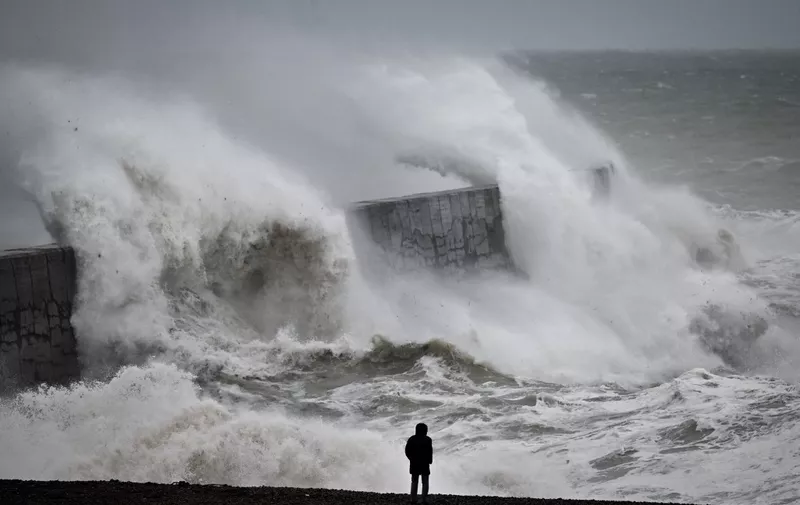 Waves crash the harbour wall in Newhaven, southern England on November 2, 2023, as strong winds and heavy rain from Storm Ciaran hit Britain. High winds and heavy rain brought by storm Ciaran caused major disruption in southern England on November 2, 2023, with shipping from the port of Dover suspended for several hours and hundreds of schools closed. Winds of up to 100/110 km/h were expected in the morning, and up to 100 km/h in the afternoon, according to the weather forecast on the British government website. (Photo by Glyn KIRK / AFP)