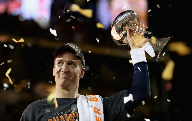 SANTA CLARA, CA - FEBRUARY 07: Quarterback Peyton Manning #18 of the Denver Broncos holds the Vince Lombardi Trophy after winning Super Bowl 50 against the Carolina Panthers at Levi's Stadium on February 7, 2016 in Santa Clara, California.   Patrick Smith/Getty Images/AFP