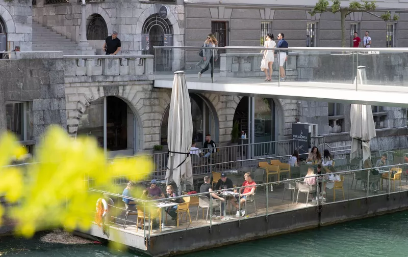 (200508) -- LJUBLJANA, May 8, 2020 () -- People enjoy their time at a cafe's terrace in Ljubljana, Slovenia, on May 8, 2020. Slovenia's COVID-19 death toll has risen to 100 after one more patient died on Thursday, according to the latest government data released on Friday.,Image: 518184787, License: Rights-managed, Restrictions: WORLD RIGHTS excluding China - Fee Payable Upon Reproduction - For queries contact Avalon.red - sales@avalon.red London: +44 (0) 20 7421 6000 Los Angeles: +1 (310) 822 0419 Berlin: +49 (0) 30 76 212 251, Model Release: no