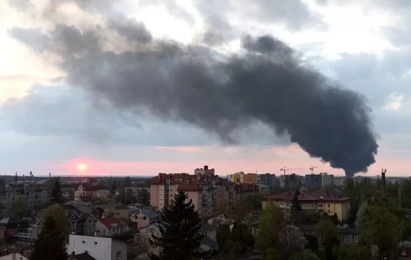 Dark smoke rises following an air strike in the western Ukrainian city of Lviv, on May 3, 2022. (Photo by Yuriy Dyachyshyn / AFP)