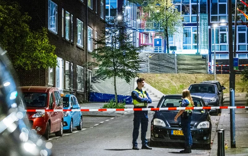 ROTTERDAM - The police and fire brigade are investigating the building on Heiman Dullaertplein where a 32-year-old man shot a 39-year-old woman and her 14-year-old daughter. The perpetrator shot a 43-year-old man in a classroom of the Erasmus Medical Center. The three victims have died. ANP JEFFREY GROENEWEG netherlands out - belgium out (Photo by ANP MAG / ANP via AFP)