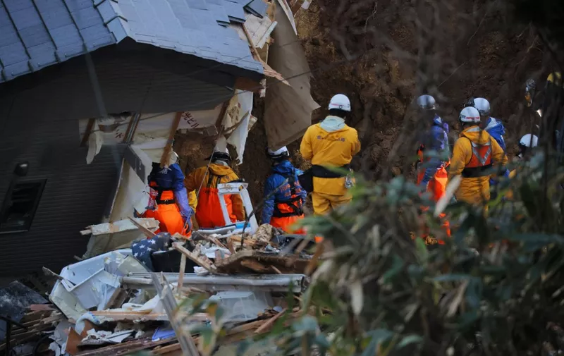 Rescue team members search for missing residents in the collapsed houses in Anamizu Town, Ishikawa Prefecture on Jan. 6, 2024. According to the Ishikawa Prefectural government, 100 people are confirmed dead.  ( The Yomiuri Shimbun ) (Photo by Takumi Harada / Yomiuri / The Yomiuri Shimbun via AFP)