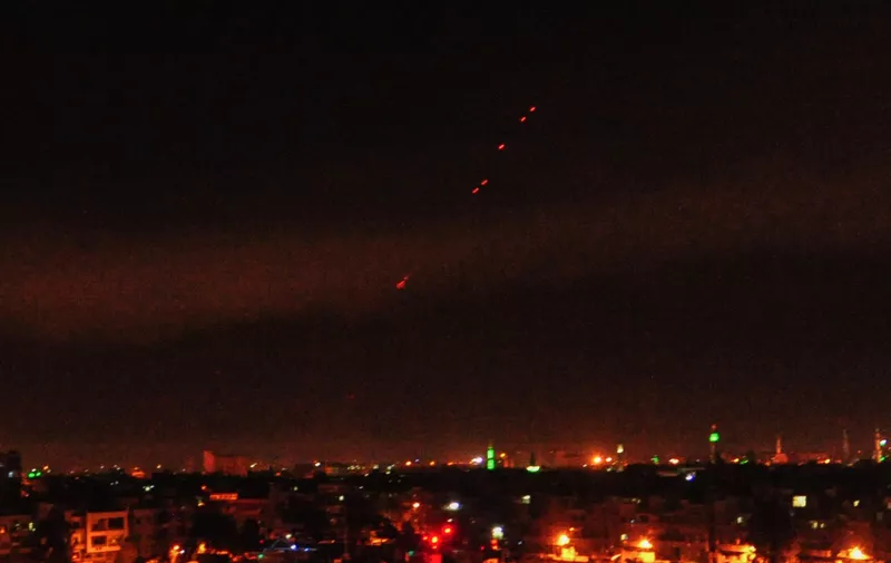 April 14, 2018 - Damascus, Syria - Surface-to-air missiles are seen over Syria's capital Damascus as the Syrian air defenses were responding to U.S. attacks. The U.S. started military actions against Damascus before daybreak Saturday as loud explosions were heard with ''red dots'' seen flying from earth to the sky., Image: 368487683, License: Rights-managed, Restrictions: , Model Release: no, Credit line: Profimedia, Zuma Press - News