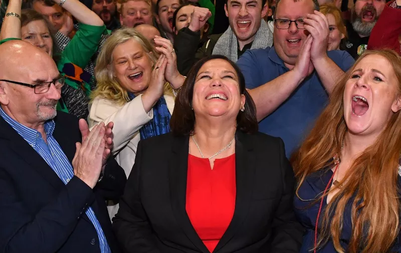 Irish republican Sinn Fein party leader Mary Lou McDonald (C) celebrates with her supporters after she takes the Dublin Central constituency on the first count in the RDS centre in Dublin, Ireland on February 9, 2020, the day after the vote took place in the Irish General Election. - Irish officials started tallying votes on Sunday in a general election forecast to put prime minister Leo Varadkar's party in a historic three-way tie, after a surge from republican party Sinn Fein. Counting began at 0900 GMT after an exit poll predicted Varadkar's Fine Gael party, the Fianna Fail party and Sinn Fein all received 22 per cent of first preference votes in Saturday's election. (Photo by Ben STANSALL / AFP)