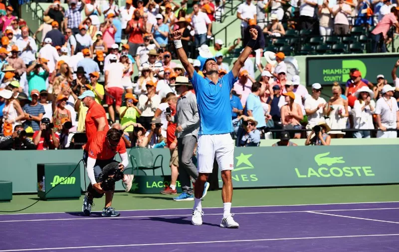 KEY BISCAYNE, FL &#8211; APRIL 05: Novak Djokovic of Serbia celebrates to the crowd after his three set victory against Andy Murray of Great Britain in the mens final during the Miami Open Presented by Itau at Crandon Park Tennis Center on April 5, 2015 in Key Biscayne, Florida. Clive Brunskill/Getty Images/AFP