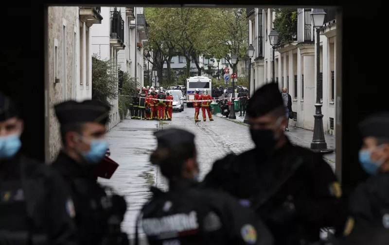 French Gendarme block the road leading to the scene of a knife attack in which several people were injured near the former offices of the French satirical magazine Charlie Hebdo in the capital Paris on September 25, 2020. - A man armed with a knife seriously wounded two people on September 25, 2020, in a suspected terror attack outside the former offices of French satirical weekly Charlie Hebdo in Paris, three weeks into the trial of men accused of being accomplices in the 2015 massacre of the newspaper's staff. Charlie Hebdo had angered many Muslims around the world by publishing cartoons of the Prophet Mohammed, and in a defiant gesture ahead of the trial this month, it reprinted the caricatures on its front cover. (Photo by GEOFFROY VAN DER HASSELT / AFP)