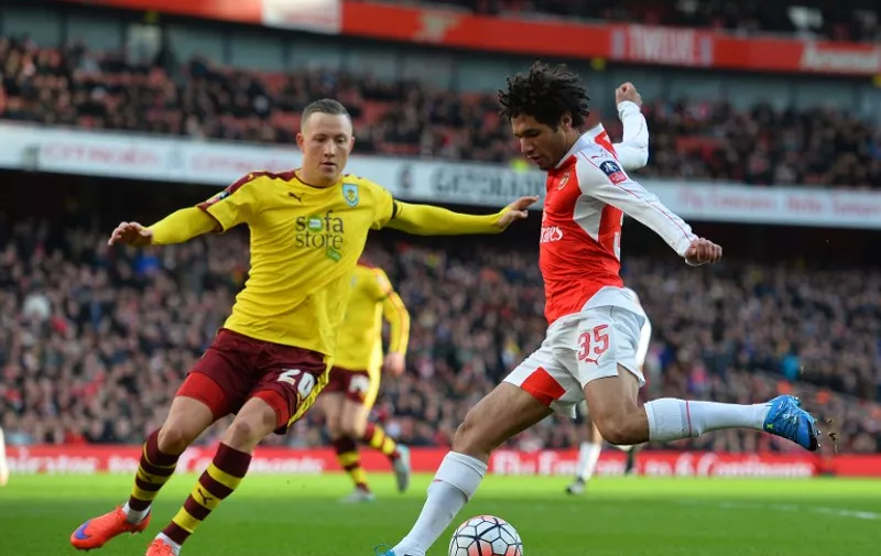Burnley's Norwegian midfielder Fredrik Ulvestad (L) vies with Arsenal's Egyptian midfielder Mohamed Elneny during the English FA Cup fourth round football match between Arsenal and Burnley at the Emirates stadium in London, on January 30, 2016. / AFP / GLYN KIRK / RESTRICTED TO EDITORIAL USE. No use with unauthorized audio, video, data, fixture lists, club/league logos or 'live' services. Online in-match use limited to 75 images, no video emulation. No use in betting, games or single club/league/player publications.  /