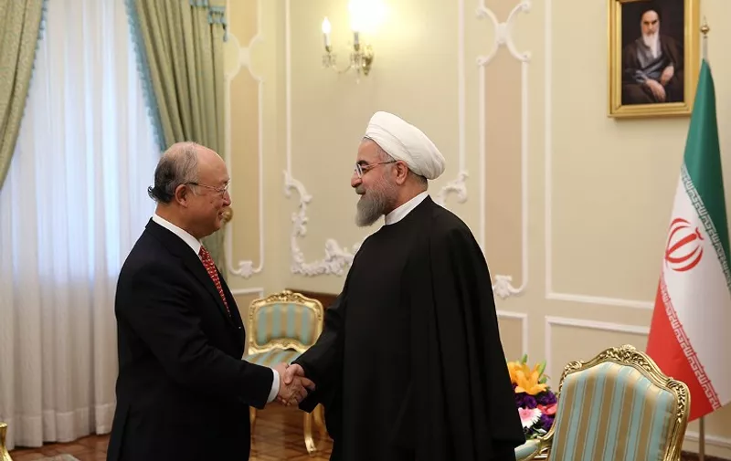 A handout picture released the official website of the Iranian President Hassan Rouhani shows him (R) meeting with UN atomic agency chief Yukiya Amano as a December deadline looms for the completion of a long-running investigation into the country's past nuclear activities on September 20, 2015 in the capital Tehran.  AFP PHOTO / HO / IRANIAN PRESIDENCY 
== RESTRICTED TO EDITORIAL USE - MANDATORY CREDIT "AFP PHOTO / HO / IRANIAN PRESIDENCY" - NO MARKETING NO ADVERTISING CAMPAIGNS - DISTRIBUTED AS A SERVICE TO CLIENTS ==