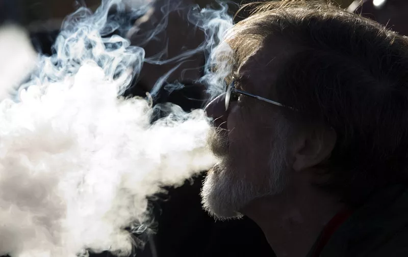 Demonstrator vapes during a rally outside of the White House to protest the proposed vaping flavor ban in Washington DC on November 9, 2019. (Photo by Jose Luis Magana / AFP)
