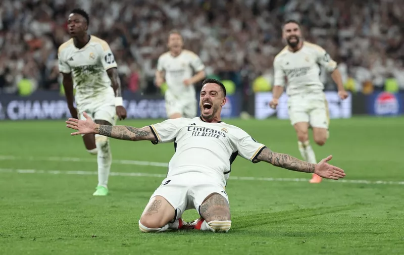 Real Madrid's Spanish forward #14 Joselu celebrates scoring during the UEFA Champions League semi final second leg football match between Real Madrid CF and FC Bayern Munich at the Santiago Bernabeu stadium in Madrid on May 8, 2024. (Photo by Thomas COEX / AFP)