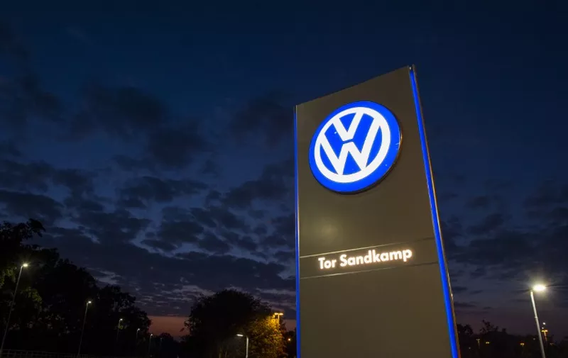 A logo of German car manufacturing giant Volkswagen is seen outside their headquarters in Wolfsburg on September 25, 2015. AFP PHOTO / JOHN MACDOUGALL