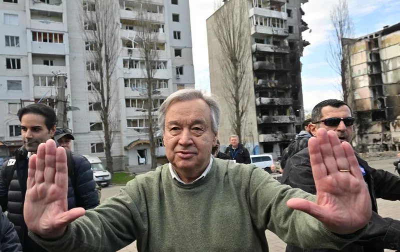 UN Secretary-General Antonio Guterres gestures as he attends a visit in Borodianka, outside Kyiv, on April 28, 2022. - UN Secretary-General Antonio Guterres arrived on April 28, 2022 to the town of Borodianka outside Kyiv where Russian forces were accused of having killed civilians, an AFP journalist on the scene reported. (Photo by Sergei SUPINSKY / AFP)
