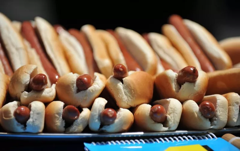 Hot dogs in buns at the official weigh-in ceremony for the Nathans Famous Fourth of July International Hot Dog Eating Contest July 3, 2012 at City Hall in New York. The contest will be held July 4 at Nathan's Famous in Coney Island. AFP PHOTO/Stan HONDA / AFP PHOTO / STAN HONDA