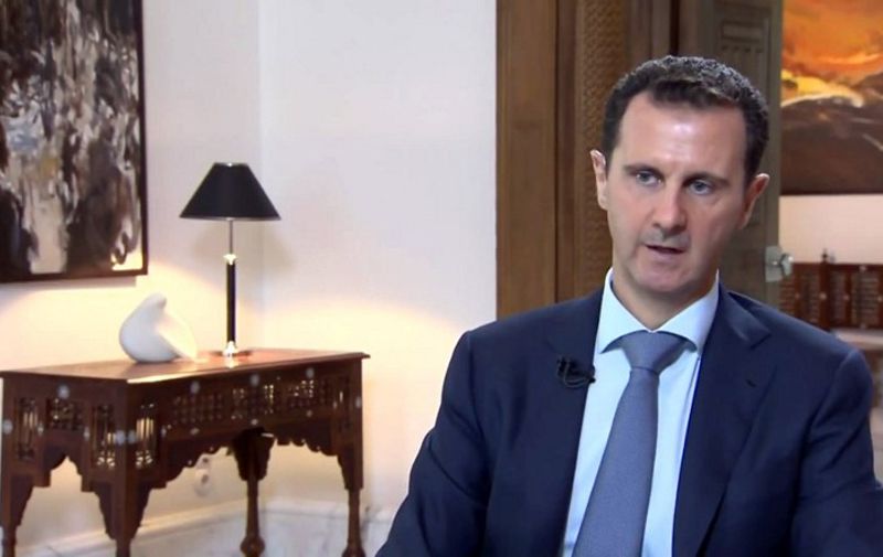 An image grab taken from the Syrian Presidency on October 4, 2015 shows Syrian President Bashar al-Assad speaking during an interview in Damascus broadcast by Khabar TV, the news channel of the Islamic Republic of Iran Broadcasting (IRIB). Assad said that the success of Russia's military intervention in his country's civil war was vital for the whole Middle East. AFP PHOTO / HO / SYRIAN PRESIDENCY == RESTRICTED TO EDITORIAL USE - MANDATORY CREDIT "AFP PHOTO / HO / SYRIAN PRESIDENCY" - NO MARKETING NO ADVERTISING CAMPAIGNS - DISTRIBUTED AS A SERVICE TO CLIENTS ==